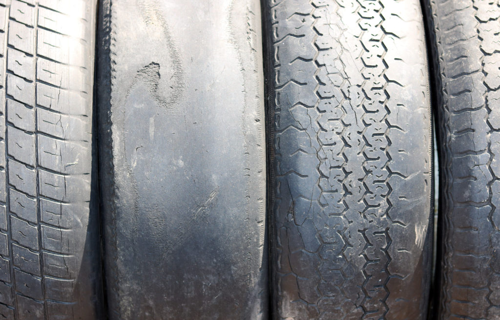 Set of tyres demonstrating uneven tyre wear